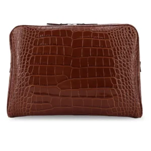 Croco-embossed leather laptop pouch by Tom Ford with double-zip closure, engraved logo, and structured silhouette.